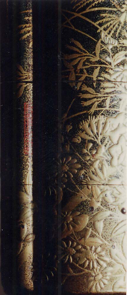 Case (Inrō) with Design of Nonomiya (Shrine in the Fields), from The Tale of Genji, chapter 10, Gold maki-e with black lacquer 
Ojime: bronze with openwork and inlay of water birds on stream 
Netsuke: carved red lacquer, Japan