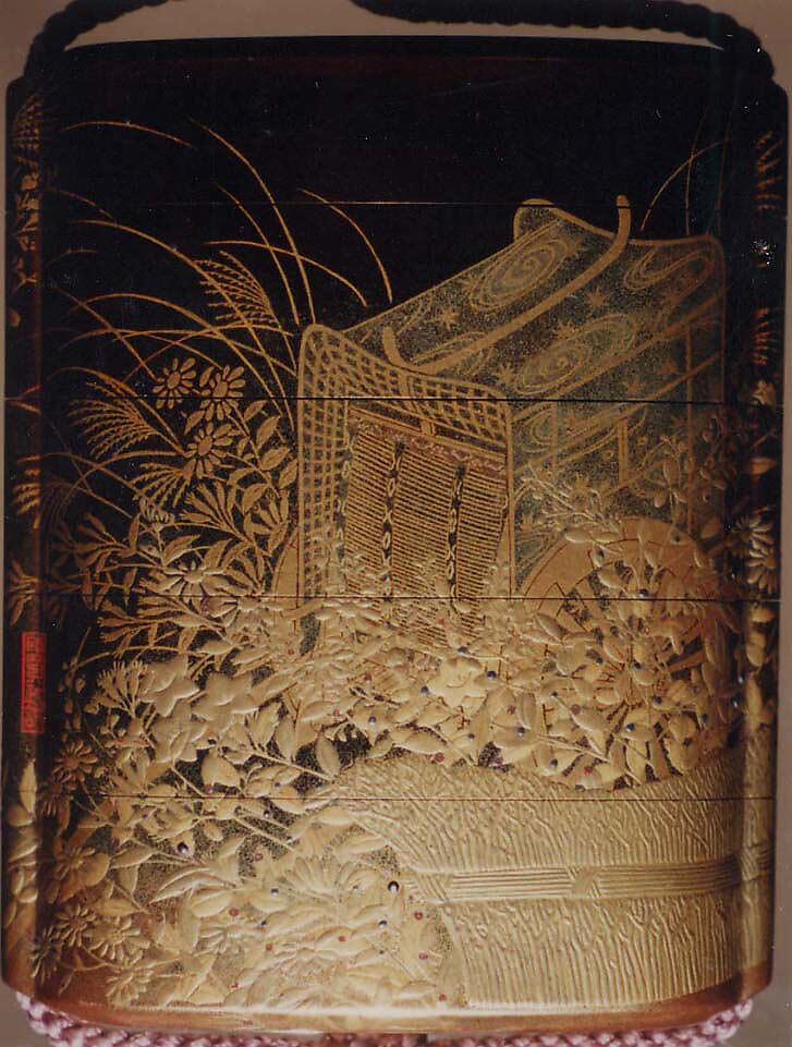 Case (Inrō) with Design of Nonomiya (Shrine in the Fields), from The Tale of Genji, chapter 10, Gold maki-e with black lacquer 
Ojime: bronze with openwork and inlay of water birds on stream 
Netsuke: carved red lacquer, Japan