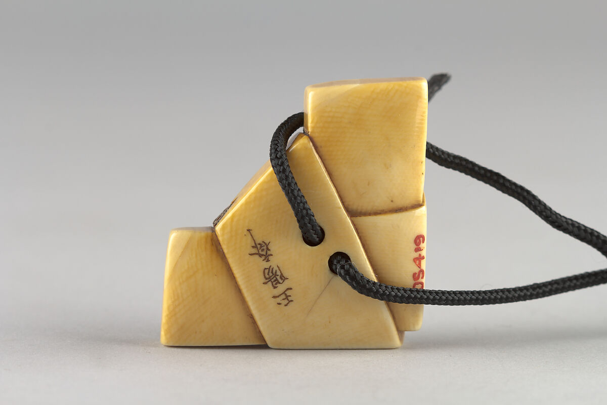 Netsuke Carved in Shape of Folded Letter on Paper Decorated with Court Motifs, Ivory, Japan