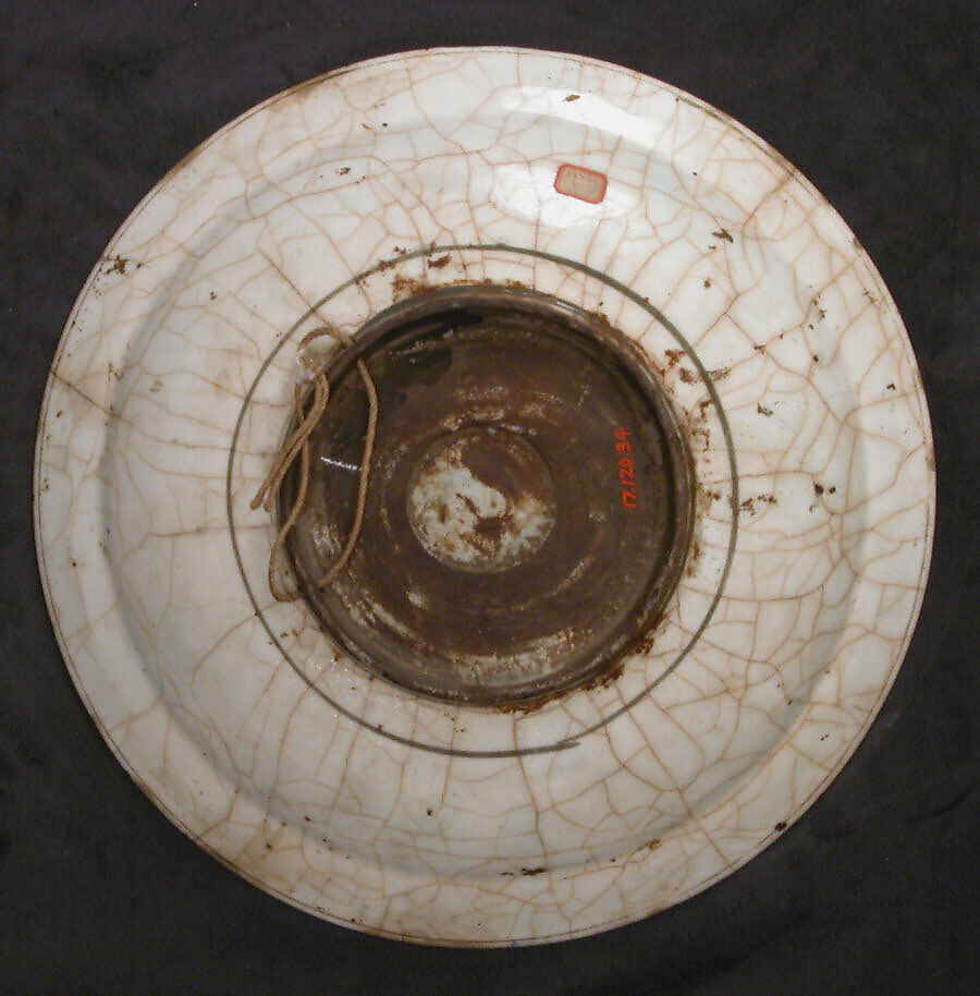 Dish, Stonepaste; underglaze painted in black, blue, and green with red and yellow slips