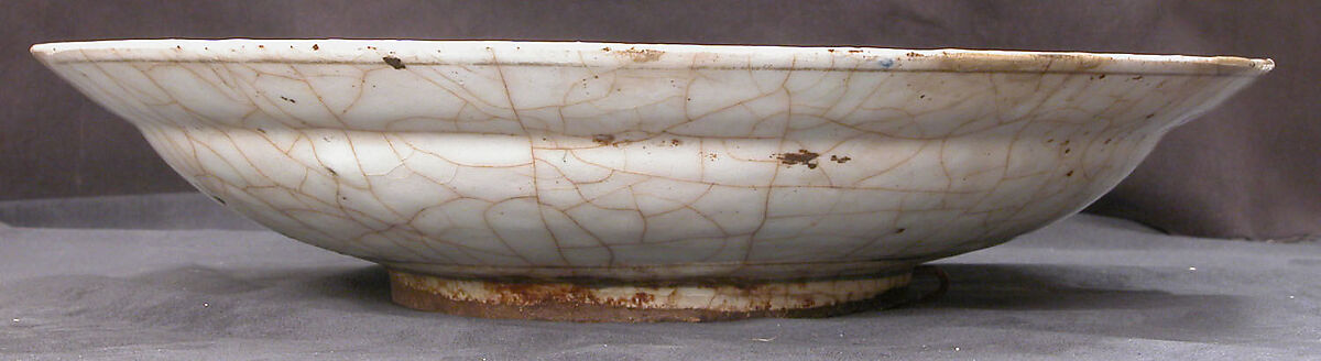 Dish, Stonepaste; underglaze painted in black, blue, and green with red and yellow slips