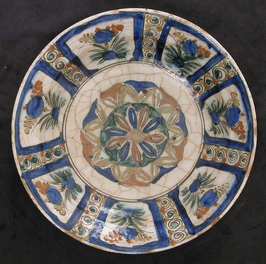 Dish, Stonepaste; underglaze painted in black, blue, and green with red and yellow slips 