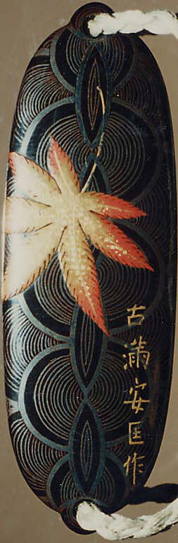 Case (Inrō) with Design of Maple Leaves on Conventionalized Waves, Sprinkled gold and silver lacquer with inlaid mother-of-pearl; ojime is nut carved with dragon motifs; netsuke is dancer carved in wood with ivory bugaku mask; Interior: nashiji, fundame and roiro, Japan