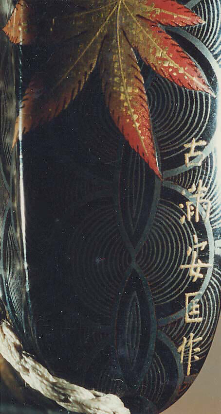 Case (Inrō) with Design of Maple Leaves on Conventionalized Waves, Sprinkled gold and silver lacquer with inlaid mother-of-pearl; ojime is nut carved with dragon motifs; netsuke is dancer carved in wood with ivory bugaku mask; Interior: nashiji, fundame and roiro, Japan