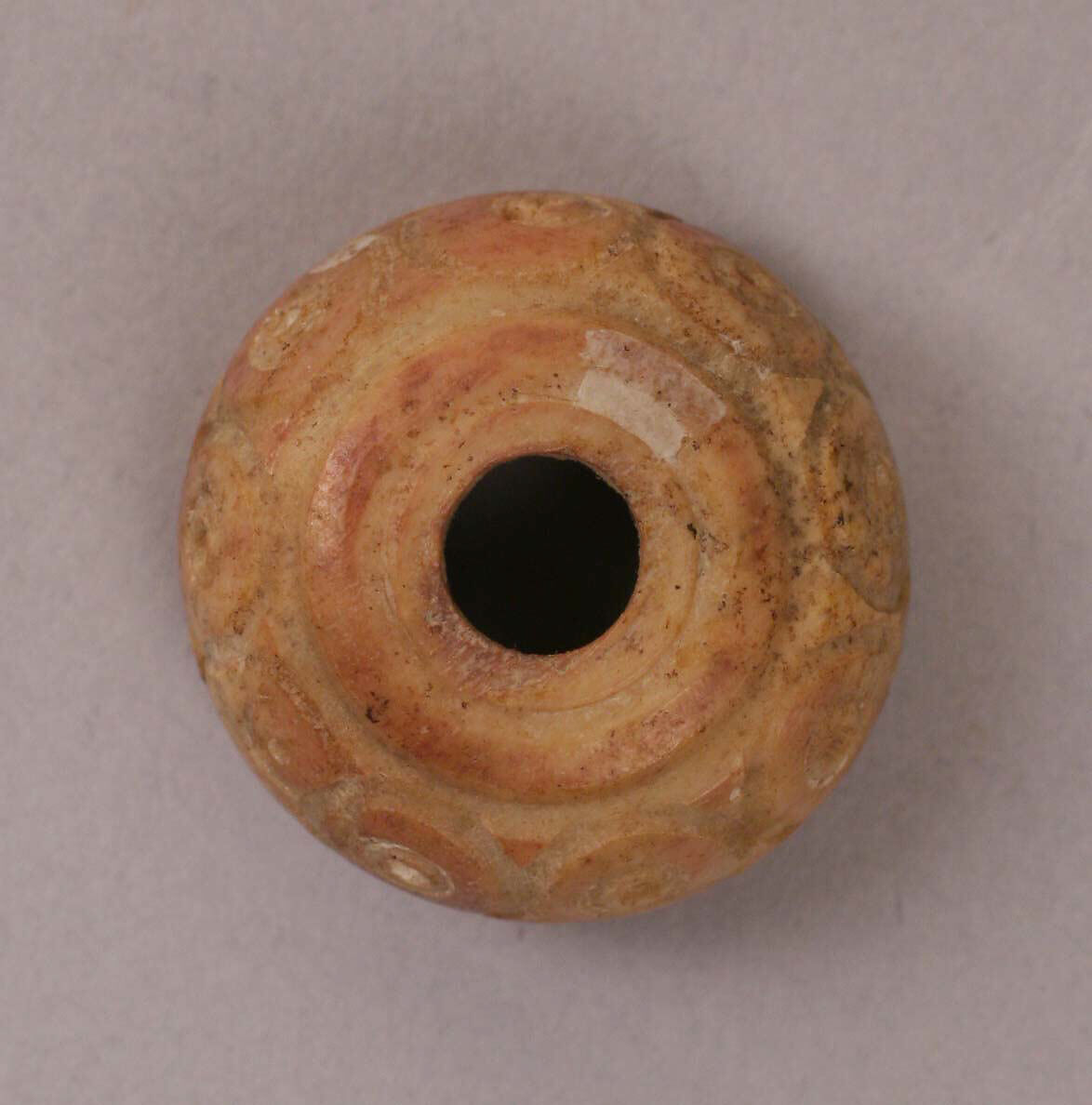 Button or Bead, Bone; tinted, incised, and inlaid with paint 