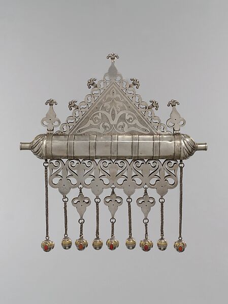 Amulet Holder, Silver; fire-gilded and chased, with decorative wire, ram’s-head terminals, openwork, slightly domed cabochon and table-cut carnelians, turquoise beads, wire chains, and spherical bells