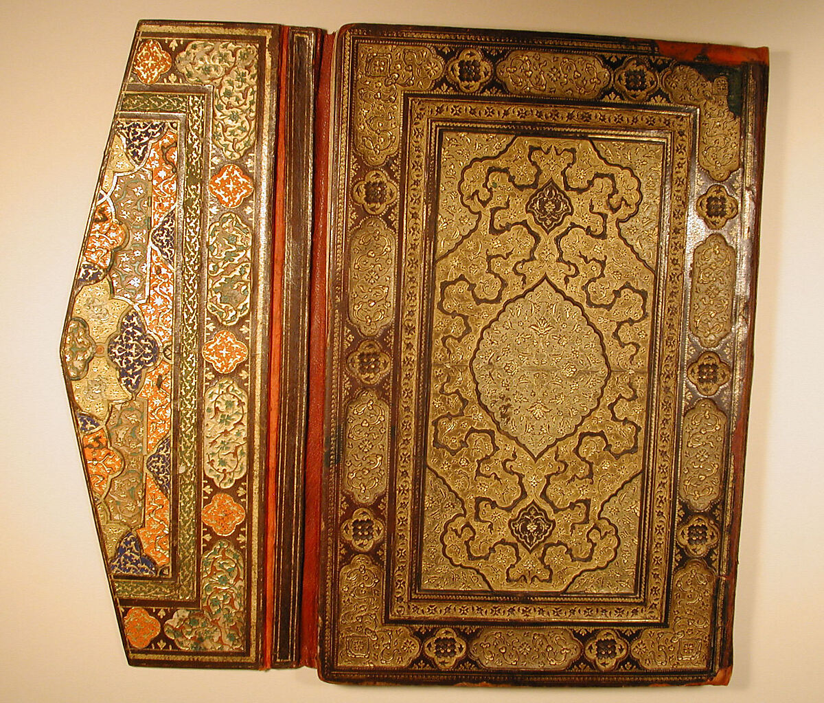 Binding and Text-Block for the Mantiq al-Tayr (Language of the Birds), Farid al-Din `Attar (Iranian, Nishapur ca. 1142–ca. 1220 Nishapur), Binding: Leather, gold, and color; carved, impressed, and gilded
Text-block: Ink, opaque watercolor, silver, and gold on paper