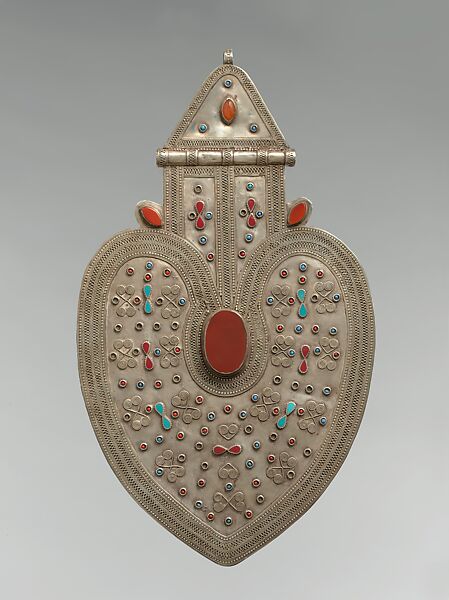 Cordiform Pendant, Silver with applied decoration, decorative wire, synthetic resin inlays, blue and red glass beads, and table-cut and cabochon cornelians.