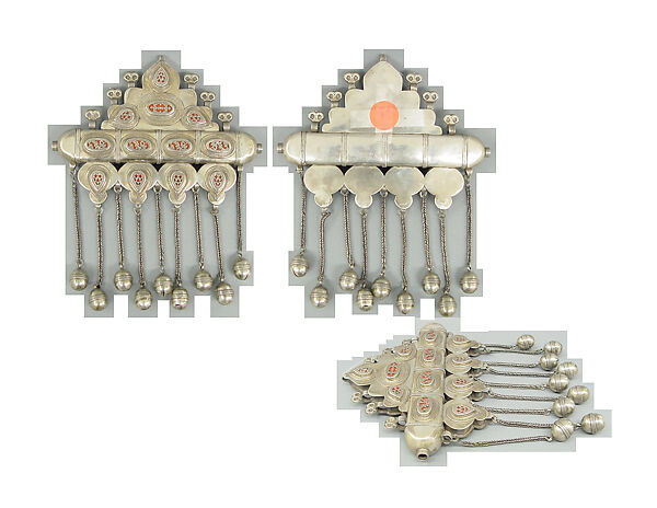 Triangular Amulet Holder, Silver with stamped beading, decorative wire, ram's-head terminals, glass inlays over red foil, lacquer, or cloth, wire chains, and spherical beads.