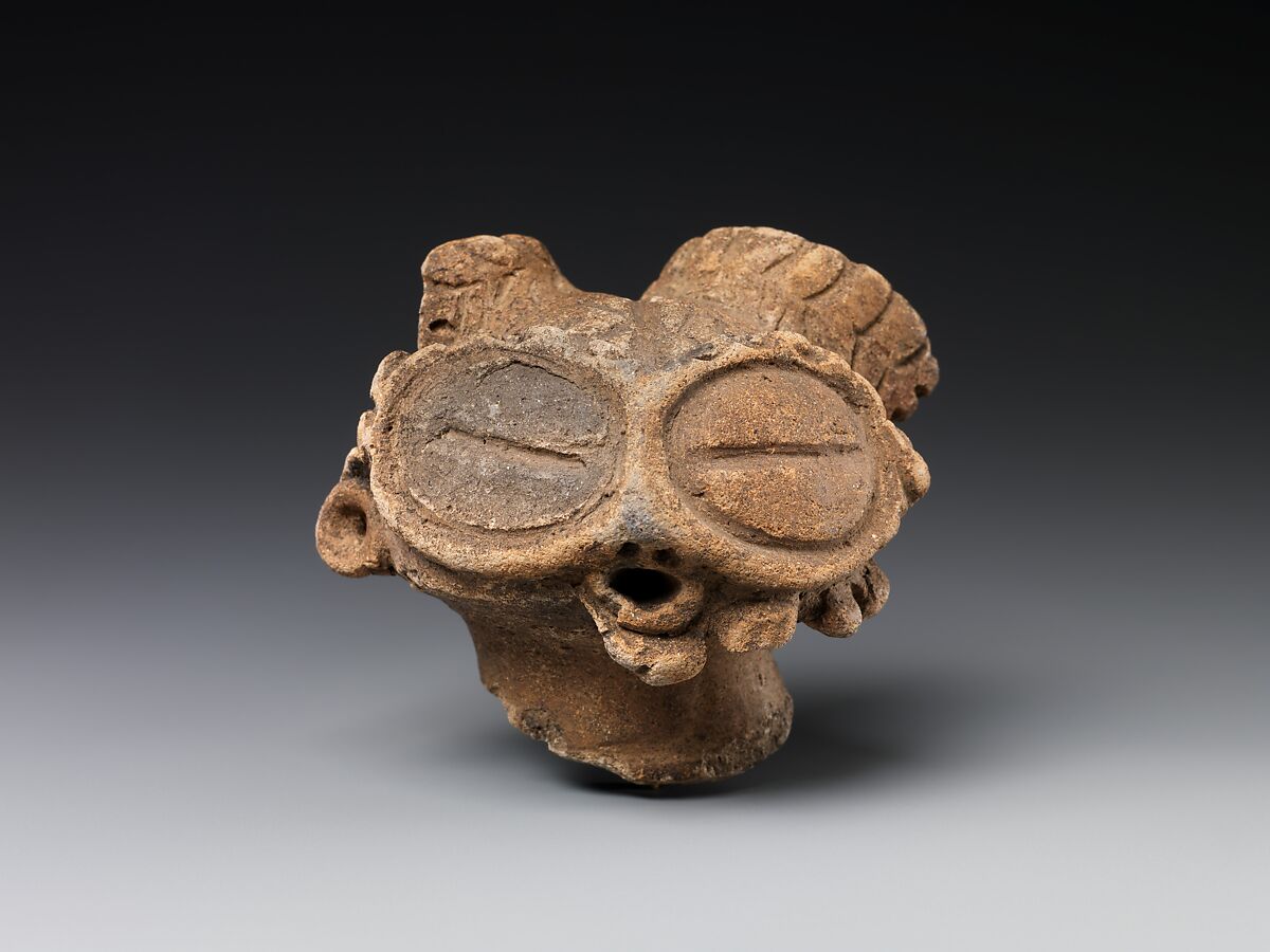 Head of a Figure (Dogū), Earthenware with incised and cord-marked designs, Japan 