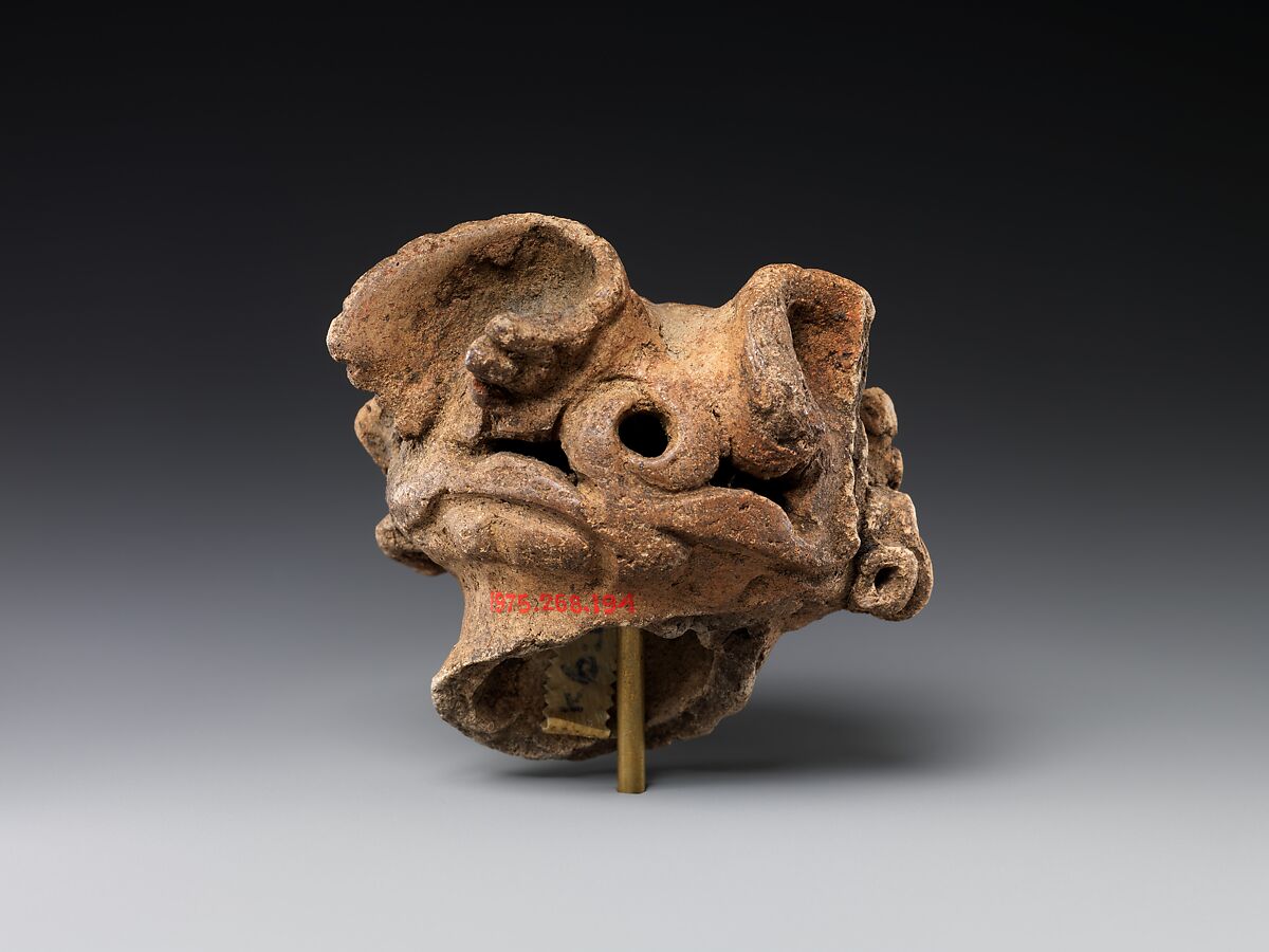 Head of a Clay Figure (Dogū), Earthenware with cord-marked and incised decoration, Japan