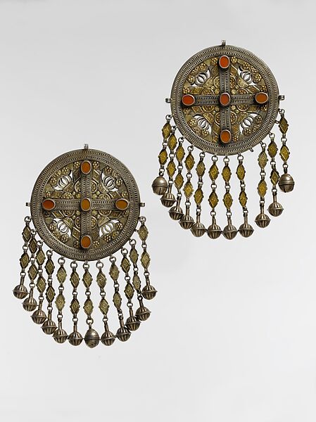 Pectoral Disc Ornament, One of a Pair, Silver with gilt applied decoration, openwork, decorative wire, connecting links with applied decoration, cone shaped and spherical bells, and table cut carnelians 