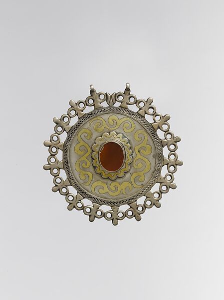 Pectoral Disc Ornament, Silver; fire-gilded and chased with rams head terminals, decorative wire and table cut carnelian 
