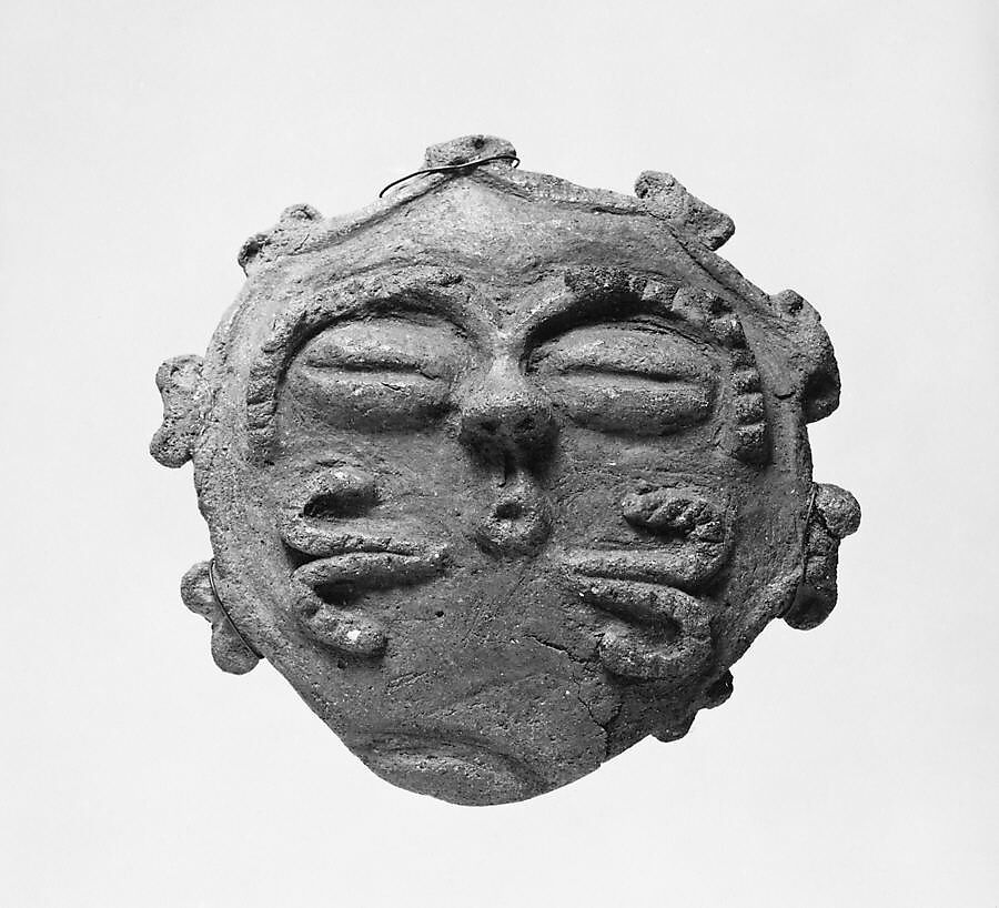 Plaque in the Shape of a Human Face, Earthenware with traces of red pigment, Japan 