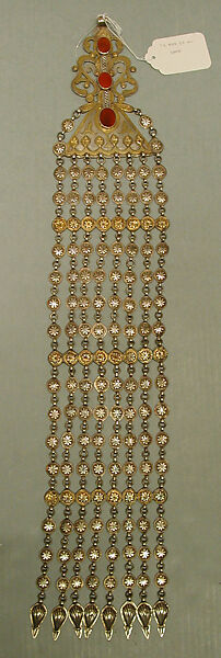 Long Temple Pendant, One of a Pair, Silver; fire-gilded and chased, with decorative wire, applied and openwork decoration, connecting links with applied decoration, embossed pendants, and table-cut carnelians