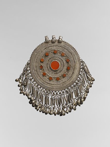 Pectoral Disc Ornament, Silver, with decorative wire, stamped beading, silver shot, applied decoration, chains, bells, and table-cut carnelians 
