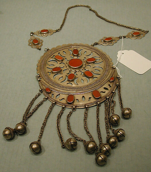 Pectoral Disc Ornament, One of a Pair, Silver; fire gilded with openwork decorations, table cut carnelians, silver twisted wire and link chains, and bells/beads