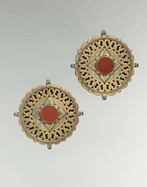 Pectoral Disc Ornament, One of a Pair, Silver; fire-gilded with stamped bead and twisted wired decoration, engraving/punching and openwork decoration and table cut carnelian 