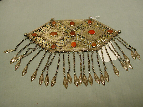 Pectoral Ornament, Silver; fire-gilded with punched and stamped openwork decoration, silver twisted chains with embossed pendants, and table cut carnelians