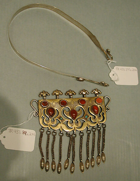 Necklet, Silver; fire-gilded and chased, with ram’s-head upper terminals, openwork, wire chains, embossed pendants, table-cut and cabochon carnelians, and turquoise beads