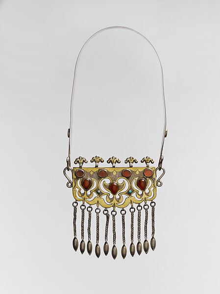 Necklet, Silver; fire-gilded and chased, with ram’s-head upper terminals, openwork, wire chains, embossed pendants, table-cut and cabochon carnelians, and turquoise beads 
