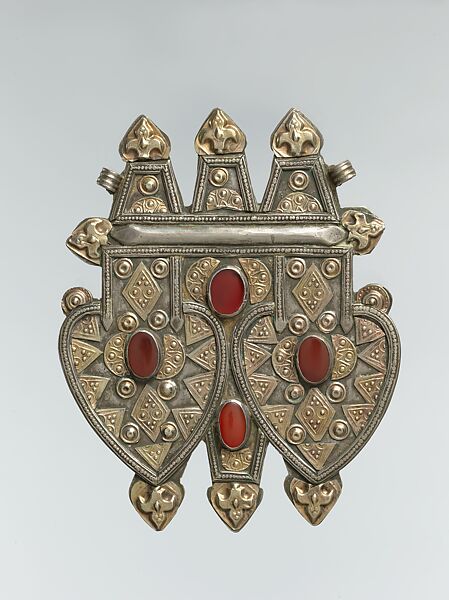 Double Cordiform Pendant, Silver; fire gilded, with applied decoration, stamping, decorative wire, ram's-head terminals, and table-cut and cabochon carnelians 