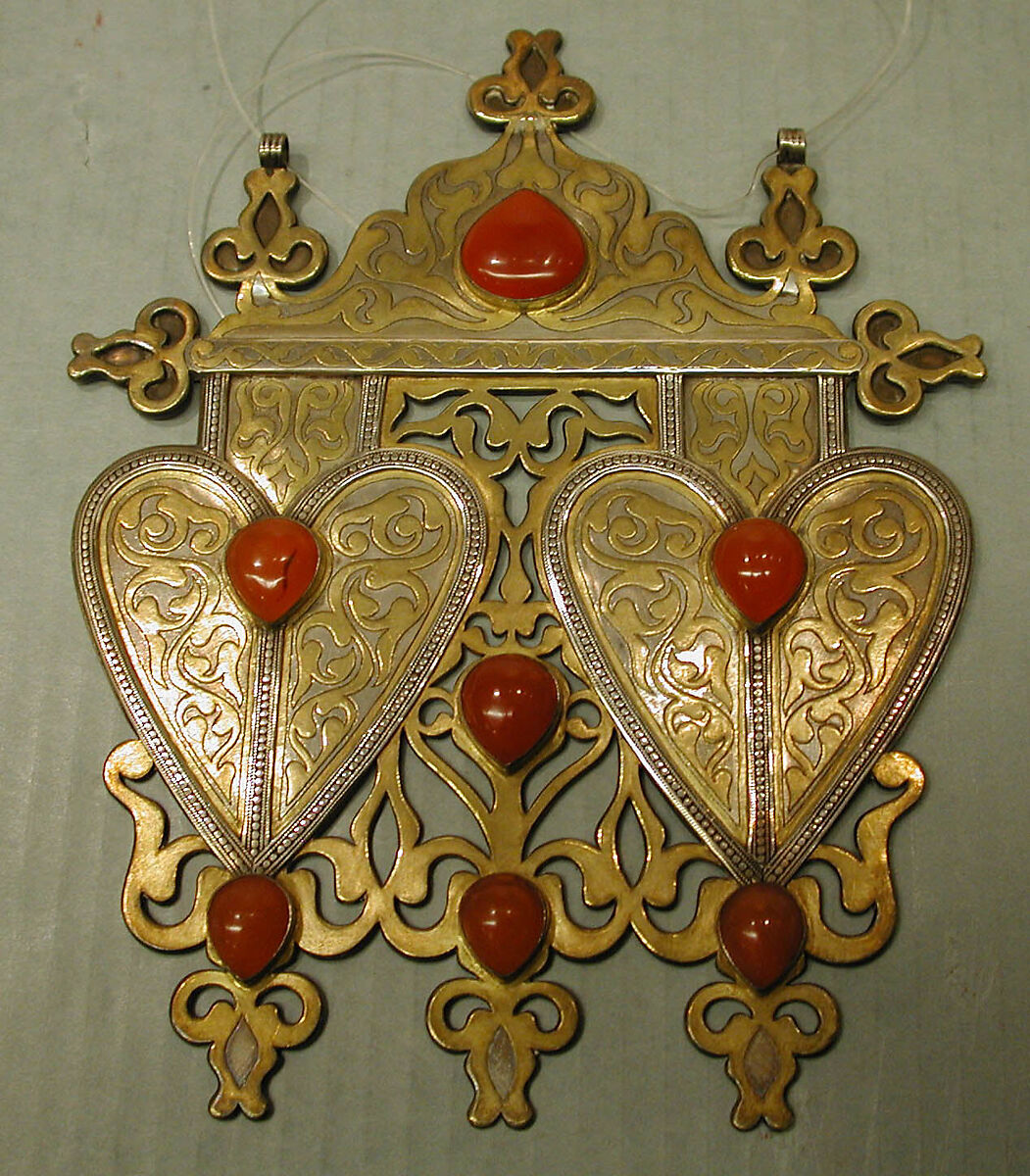 Double Cordiform Pendant, Silver; fire-gilded and chased, with decorative wire, openwork, ram's-head terminals, and cabochon carnelians