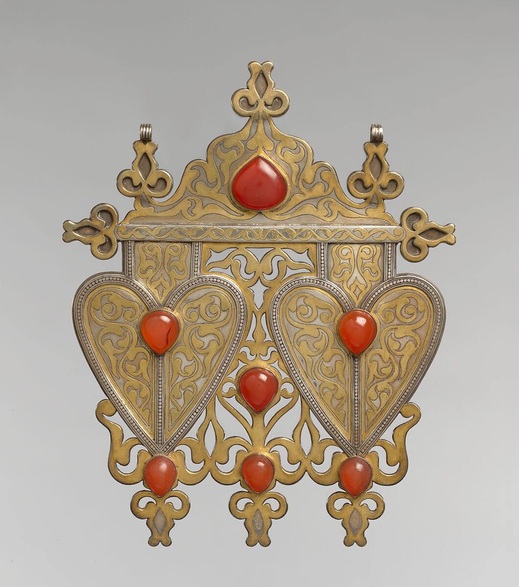 Double Cordiform Pendant, Silver; fire-gilded and chased, with decorative wire, openwork, ram's-head terminals, and cabochon carnelians 