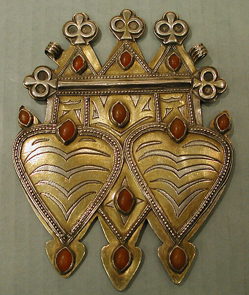 Double Cordiform Pendant, Silver; fire-gilded and chased, with decorative wire and stamping, ram's-head terminals, and cabochon carnelians