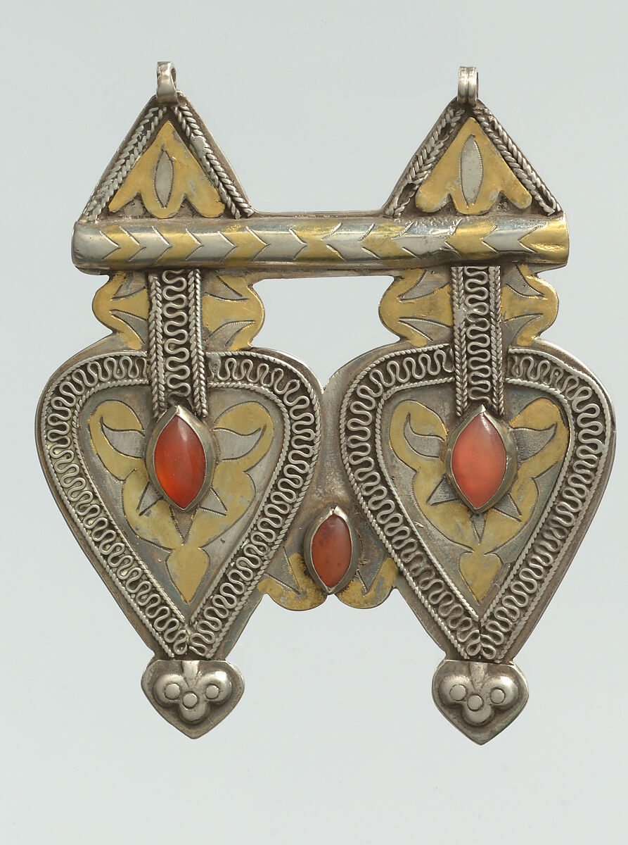 Double Cordiform Pendant, One of a Pair, Silver; fire gilded and chased, with decorative wire, ram's head terminals, embossed decoration, and cabochon carnelians