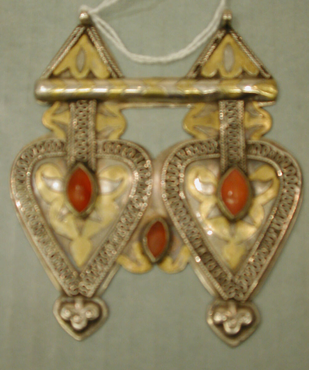 Double Cordiform Pendant, One of a Pair, Silver; fire gilded and chased, with decorative wire, ram's head terminals, embossed decoration, and cabochon carnelians 