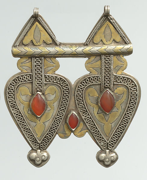 Double Cordiform Pendant, One of a Pair, Silver; fire-gilded and chased, with decorative wire, ram's-head terminals, embossed decoration, and cabochon carnelians