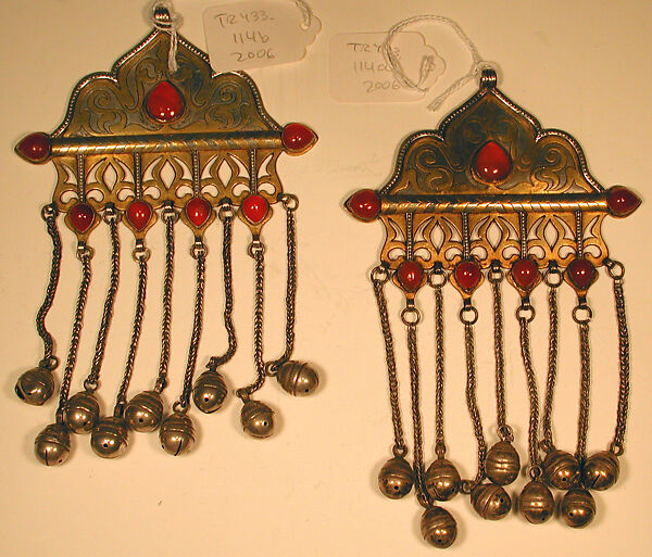 Pair of Triangular Amulet Holders, Silver, fire-gilded and chased, with decorative wire, openwork, cabochon carnelians, wire chains, and bells