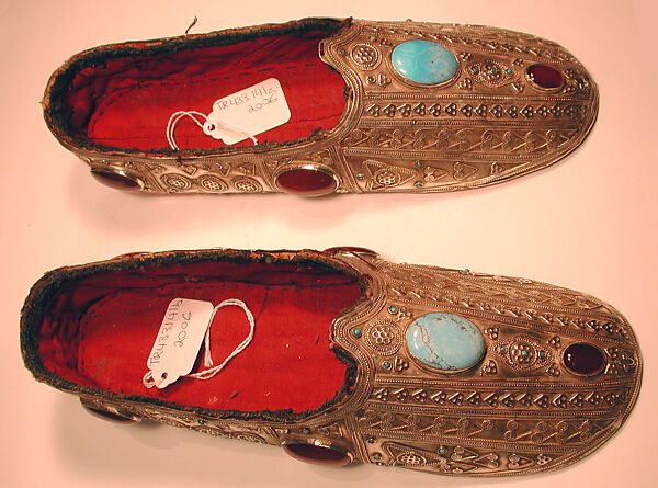Slipper, One of a Pair, Silver with applied decoration, twisted silver wire, silver stamped beading, and slightly domed turquoises and carnelians and turquoise beads lined with red cotton fabric. 