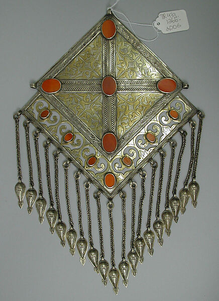 Pectoral Ornament, One of a Pair, Silver; fire gilded and chased, with decorative wire, openwork, wire chains and embossed pendants, and table cut carnelians