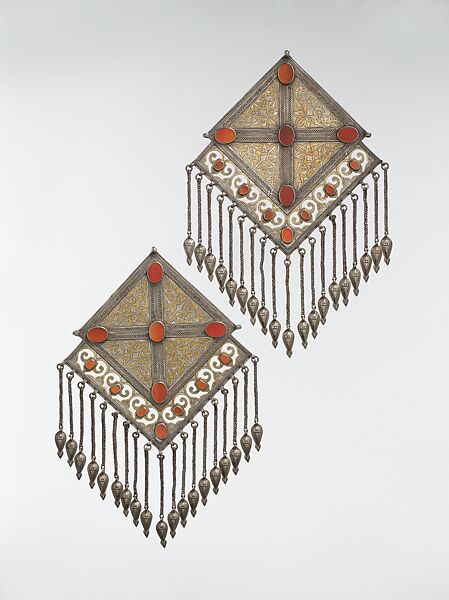 Pectoral Ornament, One of a Pair, Silver; fire gilded and chased, with decorative wire, openwork, wire chains and embossed pendants, and table cut carnelians 
