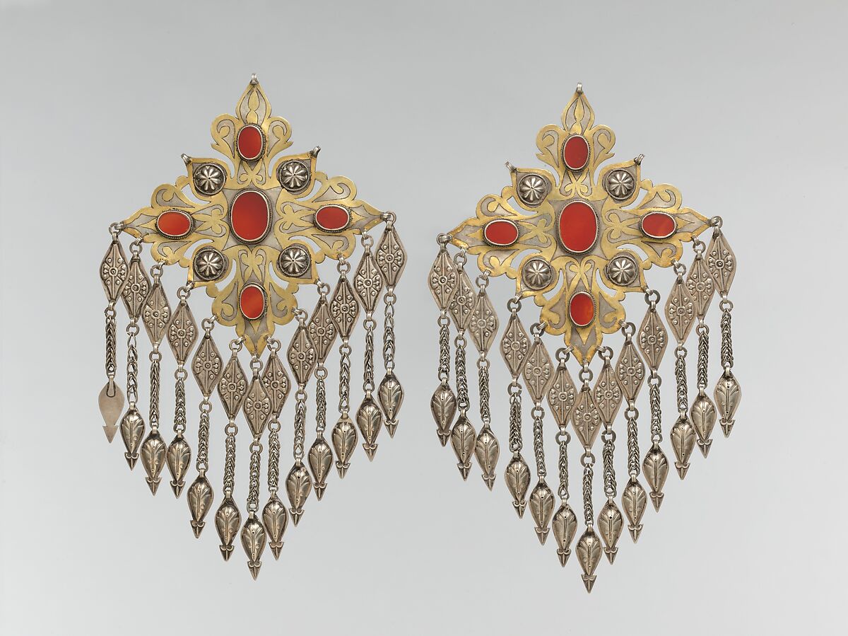 Teke Floral Pectoral Ornament, One of a Pair, Silver, fire-gilded and chased, with applied decoration, openwork, wire chains, pendants with applied decoration, and table-cut carnelians 