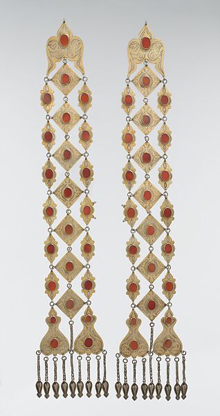 Dorsal Plait Ornament, One of a Pair, Silver, fire-gilded  and chased, with wire chains, embossed pendants, and table-cut carnelians; probably missing connecting chain 
