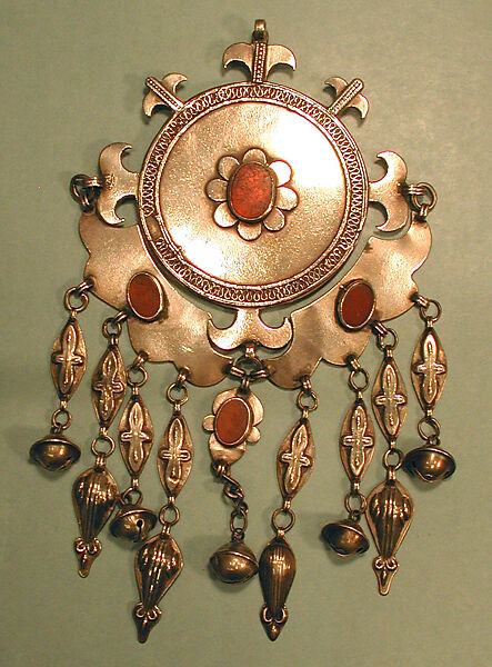 Pectoral Disc Ornament, Silver, with decorative wire, embossed pendants, ram's-head terminals, loop-in-loop chains, conical bells, and table-cut carnelians