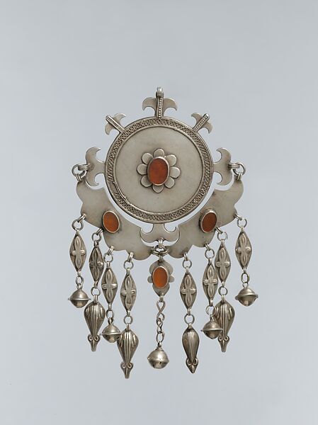 Pectoral Disc Ornament, Silver, with decorative wire, embossed pendants, ram's-head terminals, loop-in-loop chains, conical bells, and table-cut carnelians 