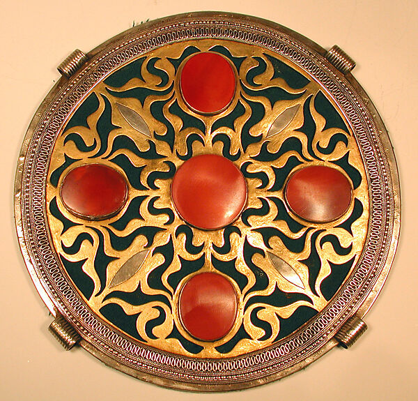 Pectoral Disc Ornament, Silver; fire gilded and chased, with openwork, decorative wire, and table cut carnelians, backed with green felt