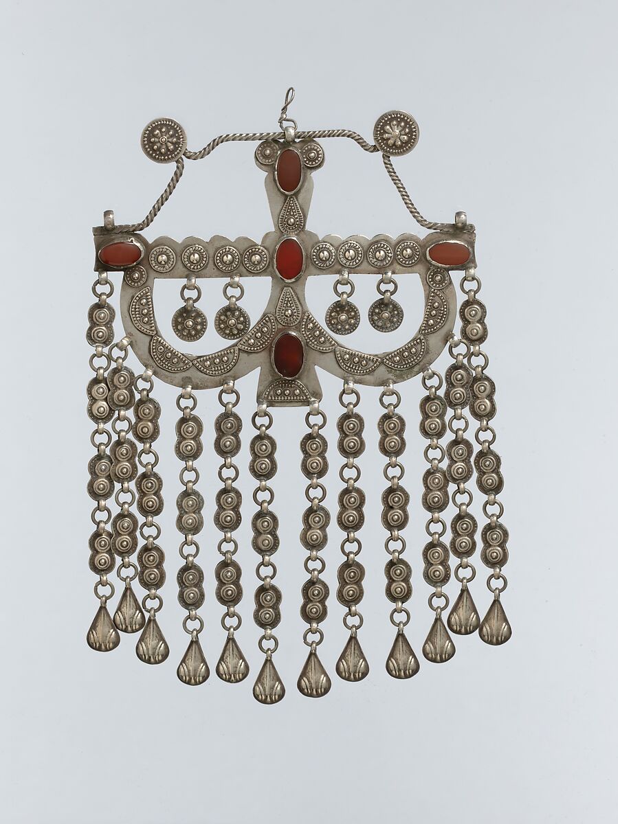 Pectoral Ornament (?), Silver, with applied decoration, twisted wire, connecting links and embossed pendants, and table-cut carnelians 