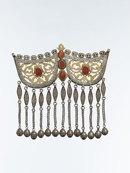 Pectoral Ornament, Silver; fire-gilded and chased, with openwork, applied decoration, wire chains, bells, ram's-head terminals, and table cut and cabochon carnelians 