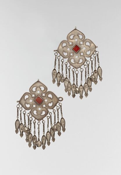 Pectoral Ornament, One of a Pair, Silver; fire-gilded with openwork, wire chains, embossed pendants bells, and table cut carnelians. 