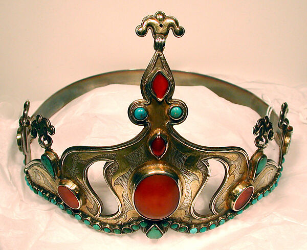 Crown, Silver; fire gilded with rams head upper terminations and engraved/punched with table cut and slightly domed carnelians and turquoises with twisted wire decorations