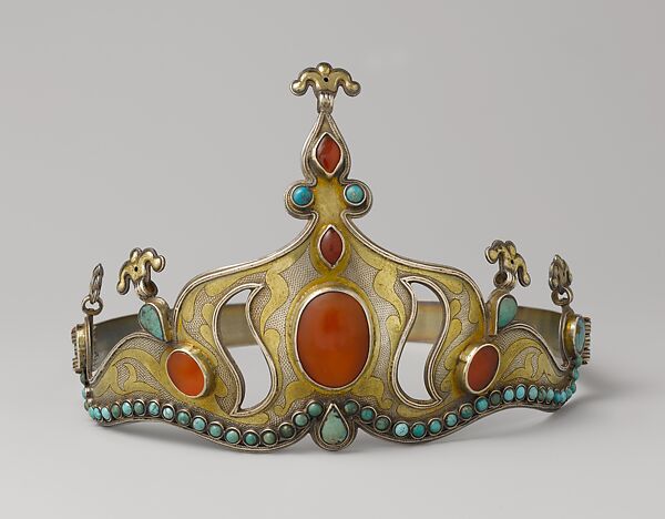 Crown, Silver; fire gilded with rams head upper terminations and engraved/punched with table cut and slightly domed carnelians and turquoises with twisted wire decorations 