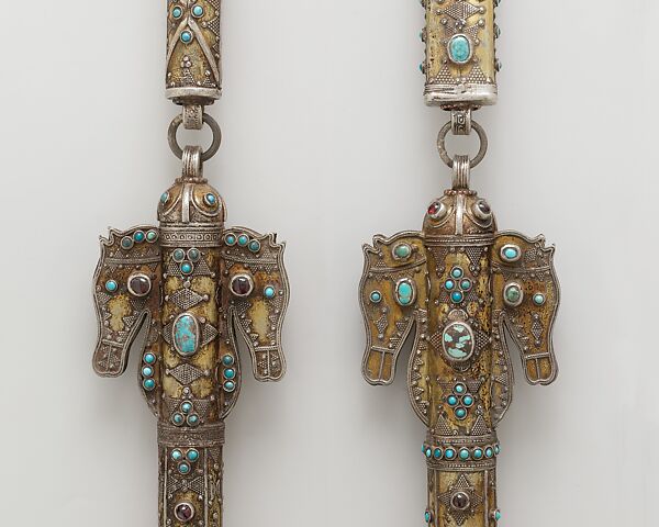 Whip, One of a Pair, Silver; fire-gilded with horse head terminals, stamped beading, silver shot and twisted wire, cabochon turquoises and glass beads, with a leather attachment 