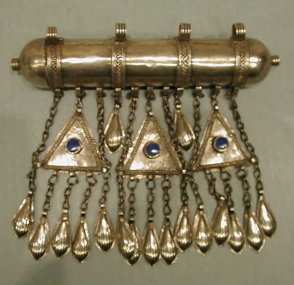 Amulet Holder, Silver; gallery wired and twisted wire decoration with glass stones, silver link chains and embossed pendants.