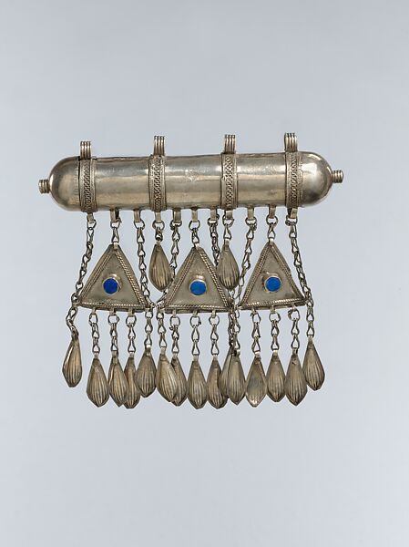 Amulet Holder, Silver; gallery wired and twisted wire decoration with glass stones, silver link chains and embossed pendants. 