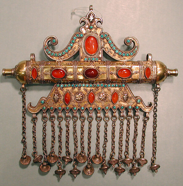 Triangular Amulet Holder, Silver; fire-gilded, with stamped beading, silver shot, decorative wire, gilt and silver applied decoration, loop-in-loop chains, cone-shaped pendants, slightly domed and cabochon carnelians, and turquoise beads